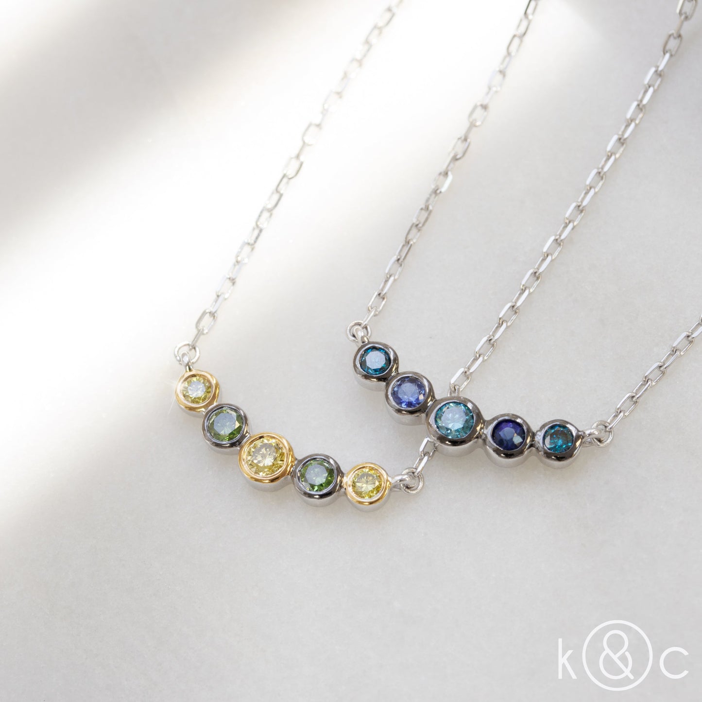 
                  
                    Kat & Chlo Yellow and Green Diamonds Smile Necklace
                  
                