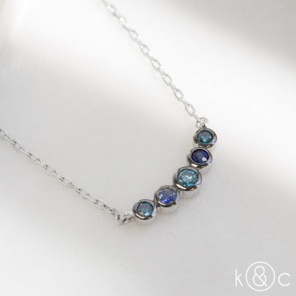 
                  
                    Kat & Chlo Blue Diamond and Sapphire Smile Necklace
                  
                